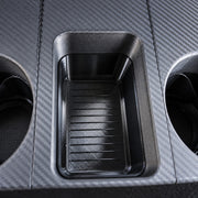 Close-up of the QuadCore Cupholder center storage compartment